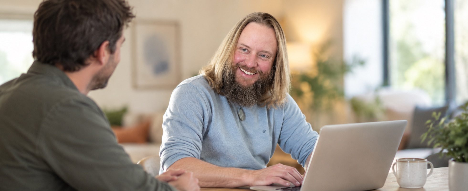 Gavin Coombs talking with another person across a laptop
